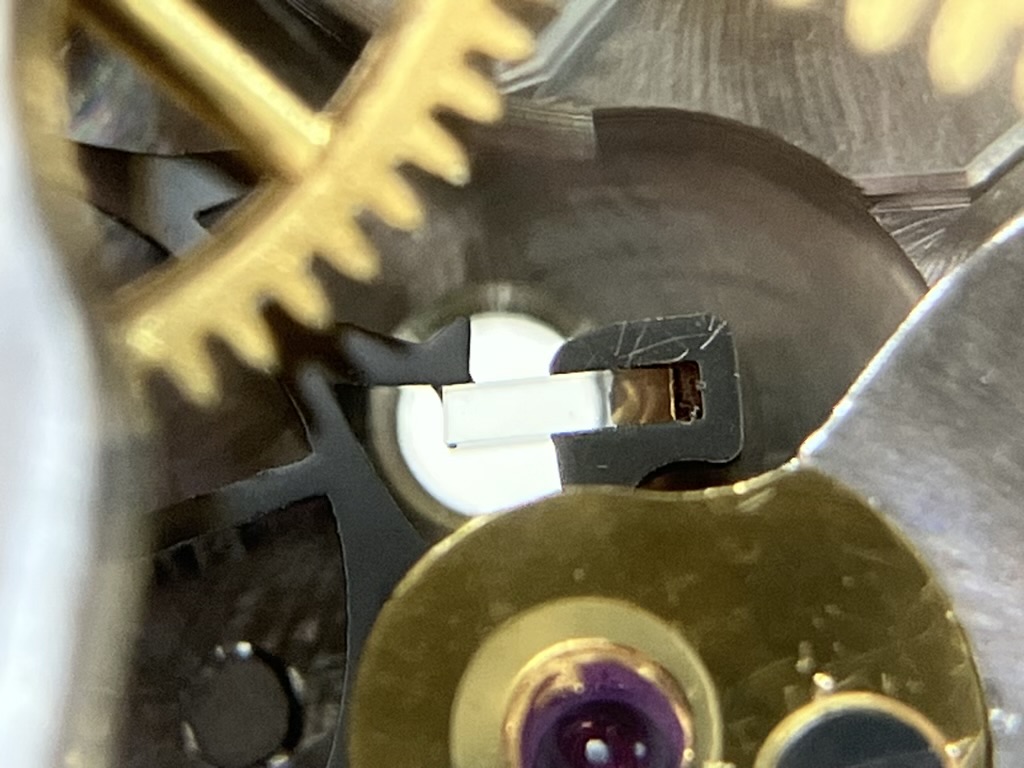 Vintage watch repair oil at escape wheel and pallet jewel